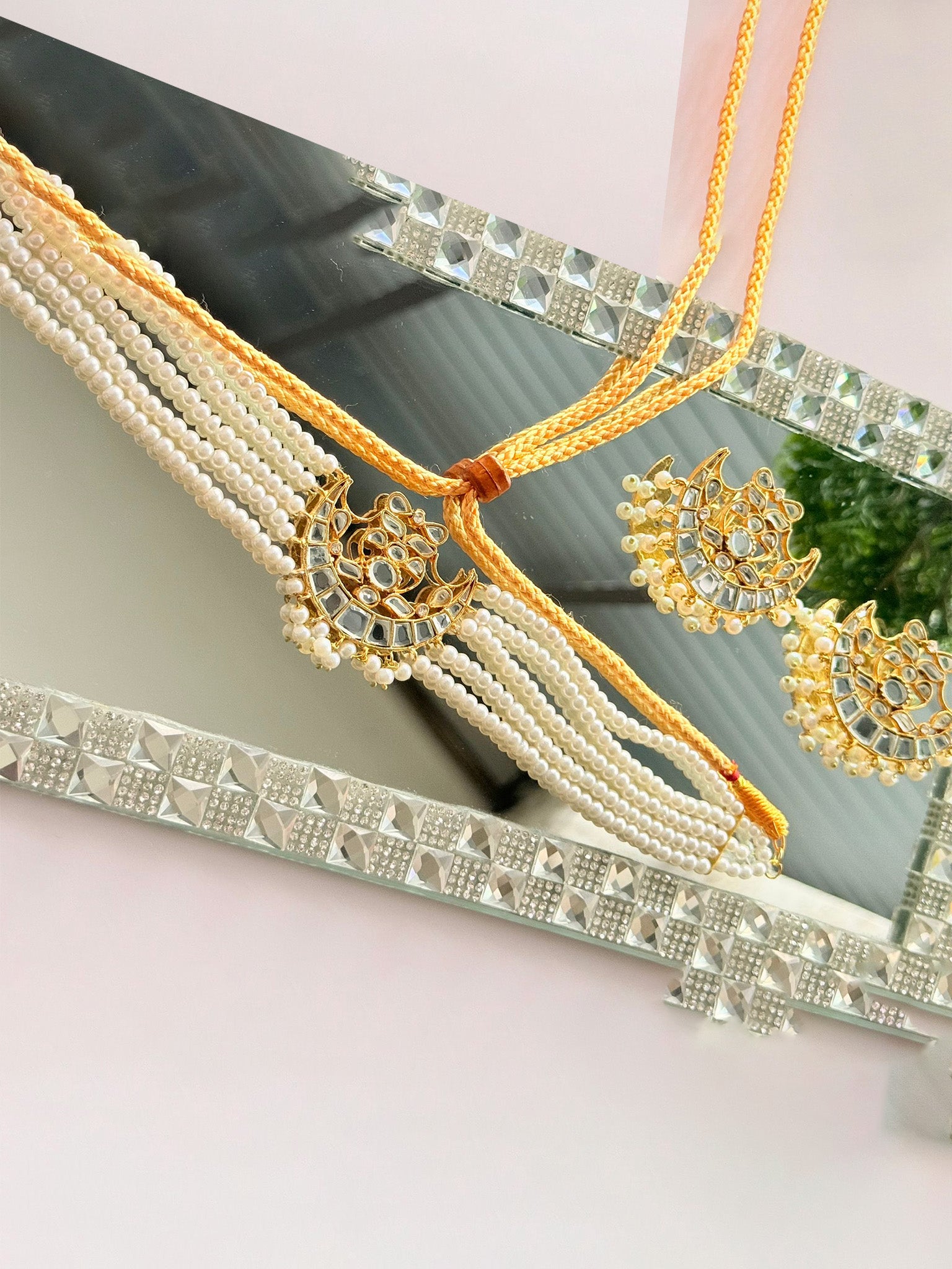 Elegant Noor E Ishq chand set featuring intricate embroidery on traditional fabric for festive or special occasions.